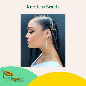 Woman with knotless braids hairstyle for natural summer hair care