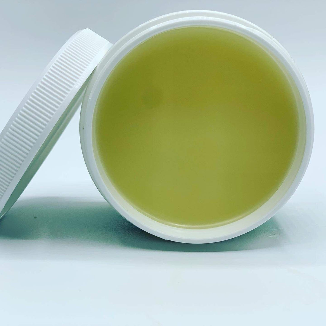 J’Organic Solutions Growth Complex Hair Growth Scalp Stimulator in a glass dropper bottle, showcasing its natural ingredients and deep-penetrating formula for healthier hair growth.






